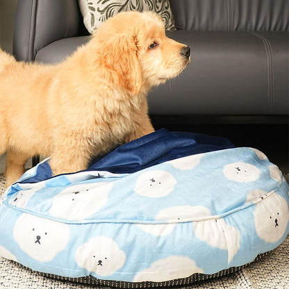 Puppy standing on Cloudy Pup Bed featuring soft blue cloud print fabric and plush cushioning in a cozy indoor living room setting