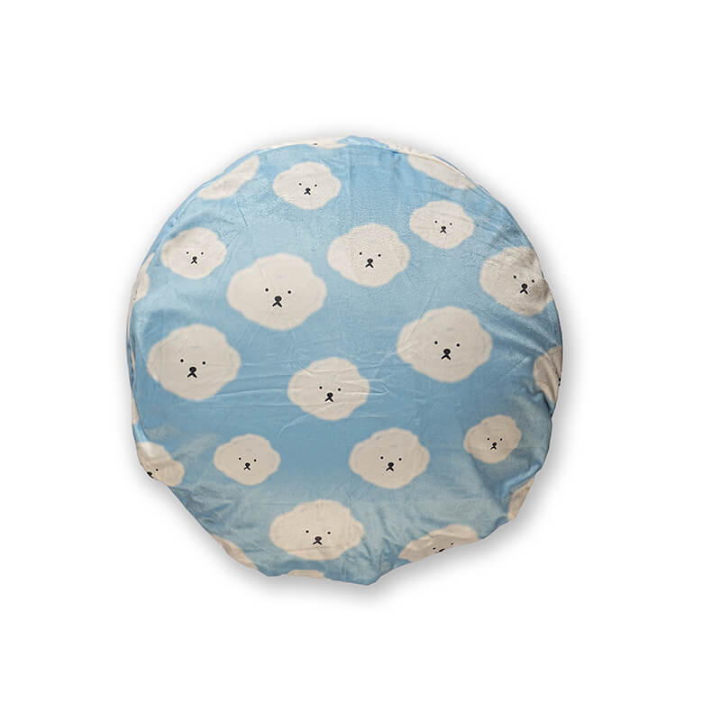 Top view of Cloudy Pup Bed featuring soft light blue fabric with cute cloud face print in a round cushioned design