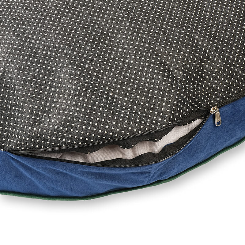 Luna Round Bed showing removable cover with open zipper, anti-slip bottom fabric, and visible inner cushioning for easy cleaning