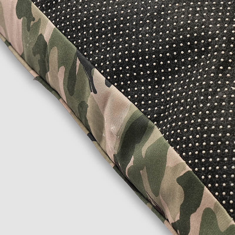 Close-up of Military Bed bottom edge showing anti-slip dotted fabric with camouflage border stitching for durability