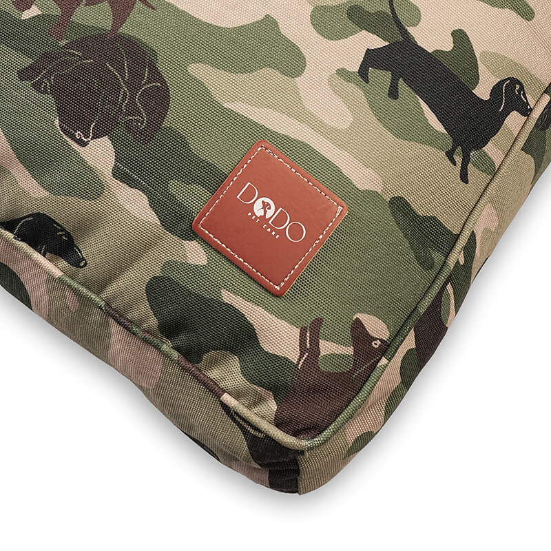 Military Bed corner detail showing DODO Pet Care logo on camouflage fabric with neatly stitched edges