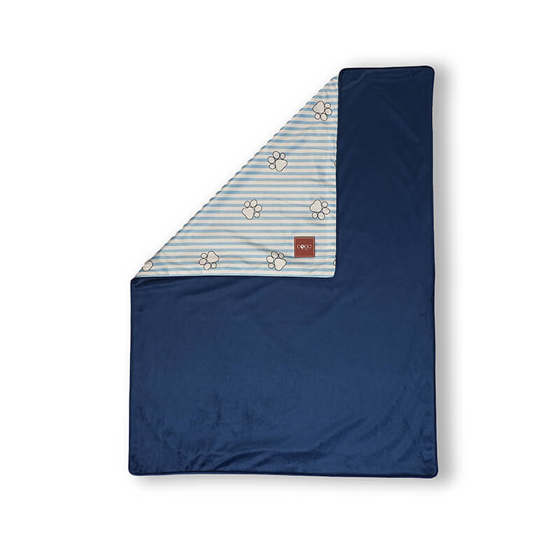 Paw Story reversible pet blanket with navy blue plush fabric and striped paw print pattern, soft and cozy blanket for dogs and cats, ideal for sofa, bed, or travel use
